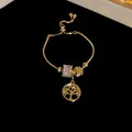 Bracelet exquis plaqué or avec pendentif arbre de vie et pierres de zircon scintillantes - Bracelet - Or - Arbre