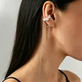 Fashionable pearl ear cuff with dangling silver chains and metal beads on model. - Pearl Tassel Ear Cuff (7164) / White K/Silver
