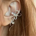 Elegant silver bow-shaped ear cuff adorned with cubic zirconia and pearls for non-pierced ears - Bow Pearl Ear Cuff (2089) / White K/Silver