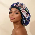 Detail of floral print satin sleeping bonnet with wide elastic band worn by model - Adjustable / Navy Blue Floral