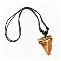 Detail view of tribal faux shark tooth resin necklace with vintage distressed finish - Brown