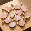 Natural rose quartz oval pendants with gold-plated edging shown on a wood surface - Rose Quartz Pendant / 1 Piece/Pack / Pink