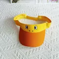 Close-up detail of a bright yellow cartoon sun visor hat with funny embroidered eyes. - The Blank-minded Little Yellow Duck / Adult Size Hat Circumference 56-60cm