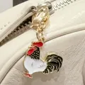 Retro rooster enamel metal keychain charm for bags with cute white and black details - Rooster
