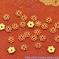 Close-up view of 7mm red enamel flower-shaped alloy bead spacers for DIY jewelry - 7mm / Red (P131)