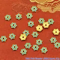 Detail view of 7mm blue enamel flower-shaped alloy bead caps for DIY jewelry making crafts - 7mm / Light Blue (P135)