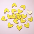 Detailed view of yellow alloy heart pendants with golden beaded edges for DIY jewelry. - Aj5-10 (16x13mm 0.8g)