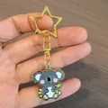 Simpatico portachiavi koala a cartone animato con anello in metallo dorato a forma di stella - Koala Nel Giardino Fiorito