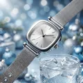 Elegant silver square watch for women with mesh strap shown in a festive blue setting. - Silver Dial