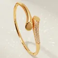 Elegant gold-plated snake-style bypass bangle featuring pavé-set shimmering clear crystals - Simple Luxury Gold Bangle BS-J5603G