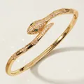 Elegant gold snake bangle with pink crystals and green eyes for women - Luxury Snake Bangle with Green Eyes BS-J5521G