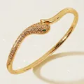 Luxury gold-plated snake bangle bracelet featuring emerald green eyes and sparkling crystals - Gold Snake Bangle with Green Eyes BS-J5528GGREEN
