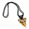 Detailed view of vintage faux shark tooth resin pendant on black rope with wooden beads - Brown