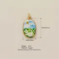 Oval landscape oil painting pendant charm in a premium gold plated copper finish - Flower Field Pendant