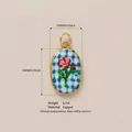 Floral painted oval pendant in blue checkered pattern with rose design and gold finish - Rose Pendant