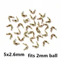 Close-up of golden stainless steel double clasp end caps for 2mm jewelry ball chains - 5x2.6mm Vacuum-sealed Genuine Gold Finish [0.04g]