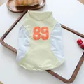 Breathable light green and white pet mesh vest featuring an orange number 89 print - 89 Cool Sports Vest - Green