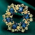 Squisita spilla vintage in stile bizantino con pietre blu brillanti e rose dorate - B358