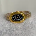 Elegant women's vintage gold bathtub quartz watch featuring black dial and steel strap - Gold Band Black Dial