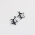 Close-up detail of two dark gunmetal solid star-shaped alloy charms for DIY jewelry making - Gunmetal Black - Large 20*17mm