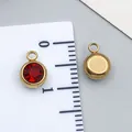 Small red birthstone pendant in gold stainless steel shown with a measurement ruler - Gold - Dark Red