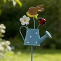 Decorative metal garden stake featuring a blue polka dot watering can with bunny and flower - Blue Rabbit