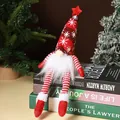 Sitting Christmas gnome with red snowflake knitted hat and LED light on books - Long Leg Doll / Red