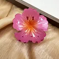 Pink gradient hibiscus flower hair claw clip with a glossy finish for hair styling. - Watermelon red