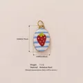 Stainless steel oval pendant featuring strawberry pattern and blue stripes design - White Strawberry Pendant