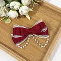 Elegant red Lolita bow hair clip featuring white lace trim and delicate pearl chain details - Burgundy