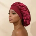 Professional model wearing a burgundy wide-brim satin hair bonnet for hair protection - Burgundy