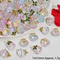 Close-up view of iridescent translucent peach charms with gold leaves for DIY jewelry crafts - Rose Pendant (S405)