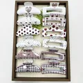 Detailed view of assorted Korean hair claw clips featuring polka dot and heart patterns. - Mixed Square & Arc Patterns (12 Pieces)