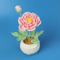 Handmade pink crochet peony potted plant with green leaves and a lace cream pot. - Pink Peony Large Yarn Potted Plant