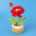 Handmade crochet red flower in a light brown potted plant with white lace trim details - Red Peony Large Yarn Potted Plant