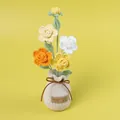 Handmade colorful crocheted flower bouquet in a beige knitted pot with brown bow detail - 4-Head Gradient Yellow Miniature Rose Potted Plant (Yarn Vase Base)