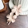 Elegant matte flower hair clip in beige finish, versatile duckbill clip for women's hair styling - Nude