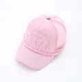 Detailed view of pink mesh trucker hat featuring embossed letter design and front rope - Pink