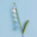 Macro detail of handmade crochet lily of the valley with blue gradient flowers - Gradient Blue