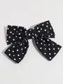 Elegante retro zwart haaraccessoire met een grote strik en witte stippen patroon - Zwarte Haarclip Met Stippen