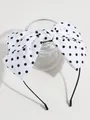 Retro wit hoofdband accessoire met een grote zwarte polkadot strik voor modieuze vrouwen. - Witte Hoofdband Met Stippen