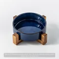 Premium kiln-transformed blue ceramic pet bowl featuring an elevated natural wood stand - Kiln Glazed Blue Water Bowl With Single Stand / Medium