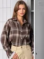 Close-up view of vintage brown plaid oversized shirt with stylish white lace cuff detailing - Coffee / S