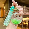 Porte-clés shaker liquide croissant de lune vert avec lapin et clochette - Perles À Bulles Vertes Phosphorescentes Lapin Étoile Et Lune