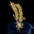 Exquisito broche de espiga de trigo dorado con circonitas amarillas y lazo brillante - B118