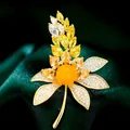 Elegante broche de flor y trigo con cristales amarillos y circonitas pavé - B511