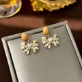 French vintage style bow earrings with yellow polka dots and central pearl detail - #9 Yellow Polka Dot Bow Pearl Earrings