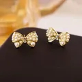Elegant French vintage style gold-toned bow-knot stud earrings adorned with pearls - 47# Micro-painted Bow Pearl Stud Earrings