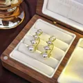 Elegant gold finish pearl stud earrings with gradient pearl design in jewelry box - 57# Curved Pearl Earring