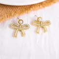 Elegant French retro gold bow stud earrings with delicate pearl embellishments - 65# Pearl Bow Earrings